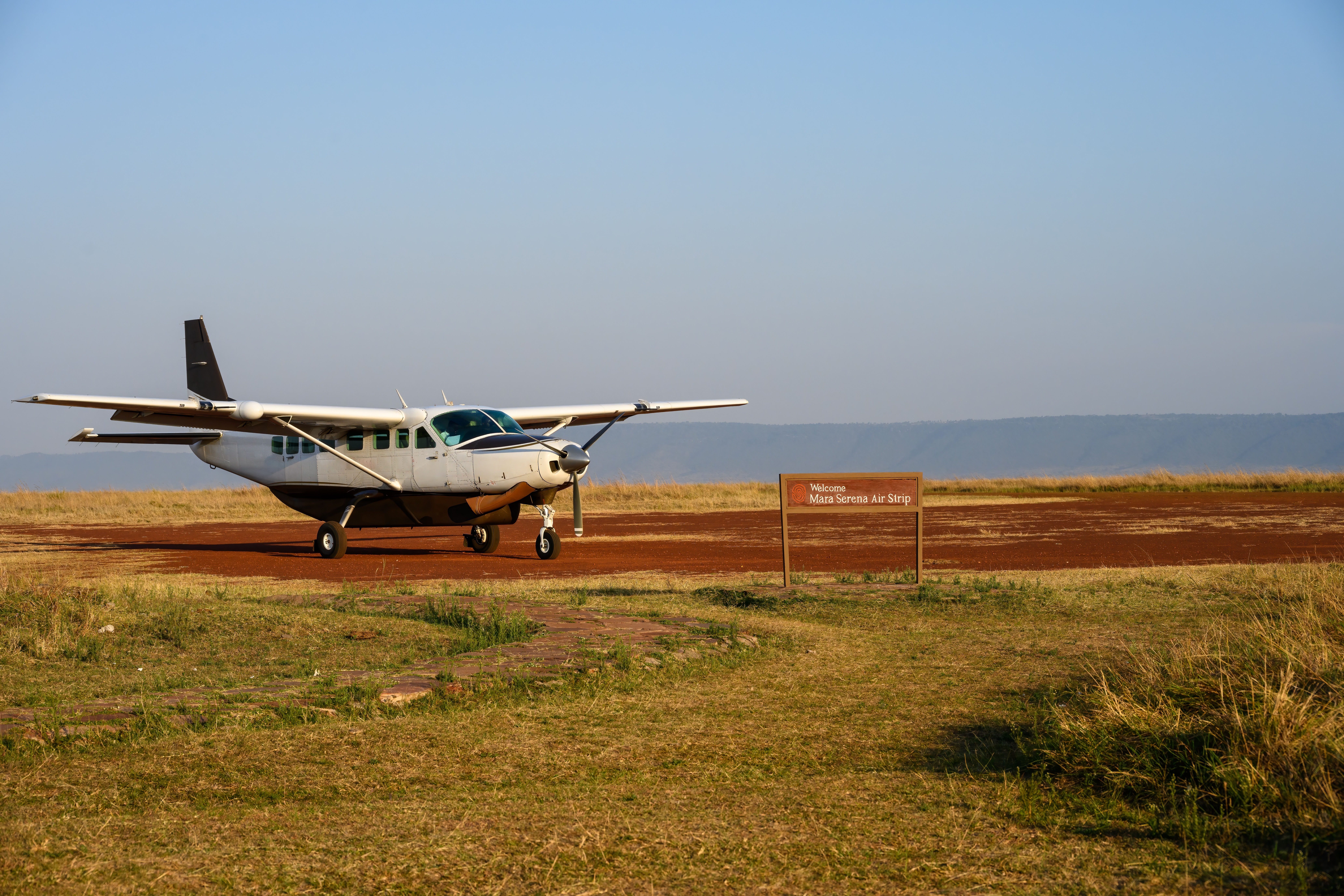 Small bush plane at an airstrip in the Masai Mara ecosystem, Kenya